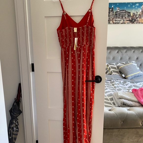 Red jumpsuit with white pattern - Picture 2 of 3